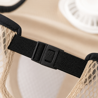 Close-up of a beige mesh garment with a black adjustable elastic band and plastic buckle.